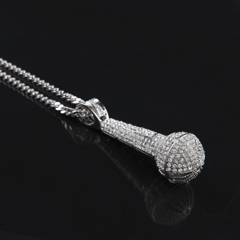 Hip-hop diamond-encrusted microphone necklaces. - MERGE.DAY.1.FREESTYLE