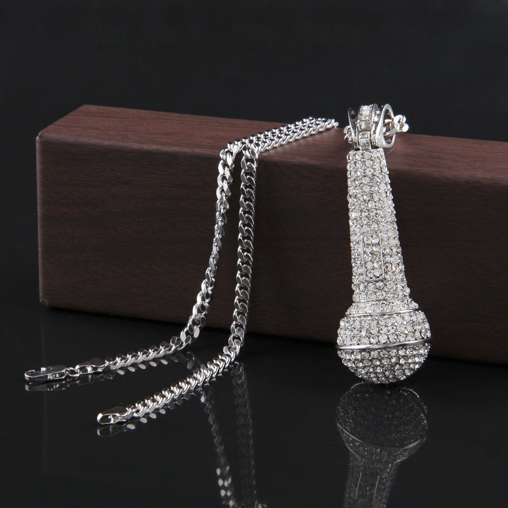 Hip-hop diamond-encrusted microphone necklaces. - MERGE.DAY.1.FREESTYLE