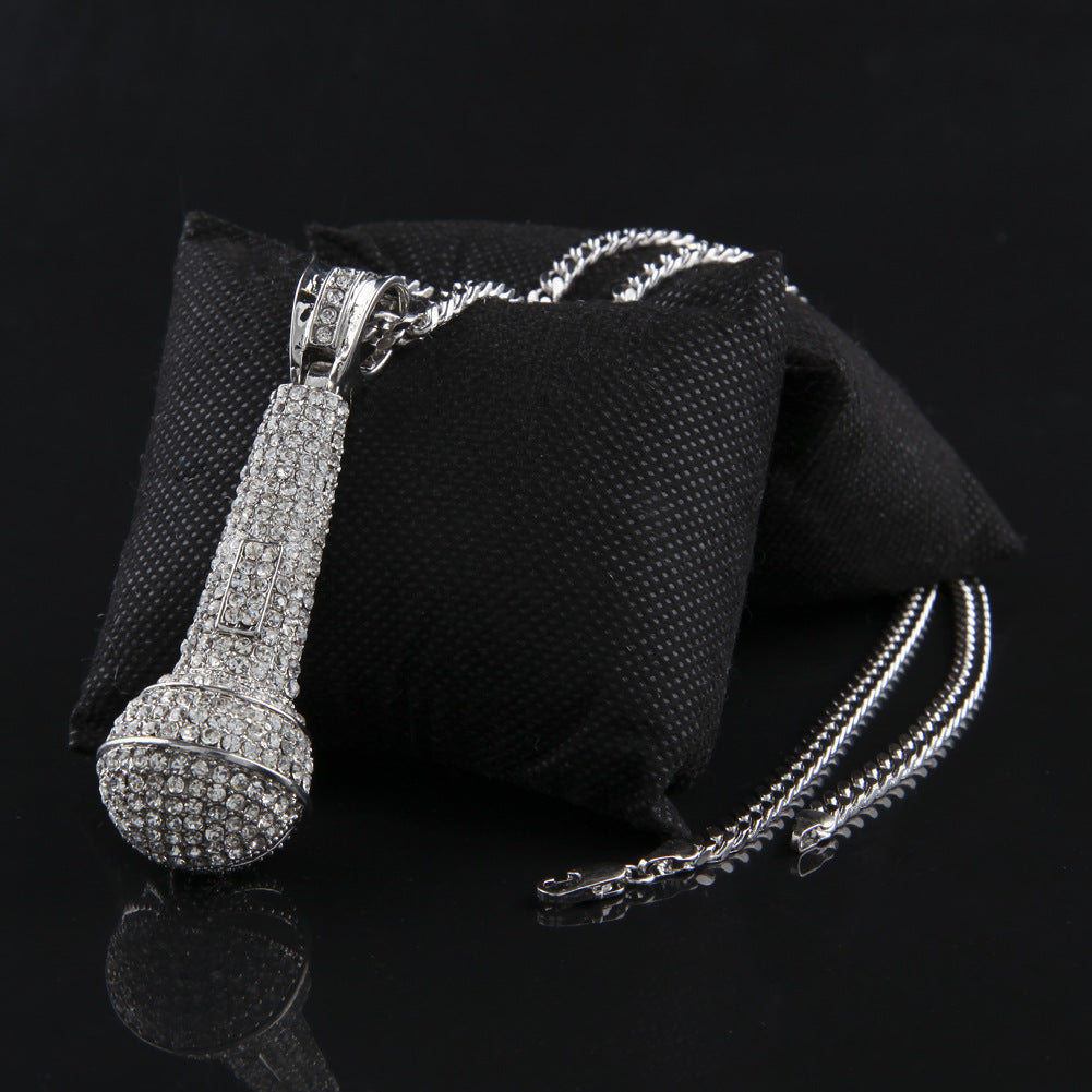 Hip-hop diamond-encrusted microphone necklaces. - MERGE.DAY.1.FREESTYLE