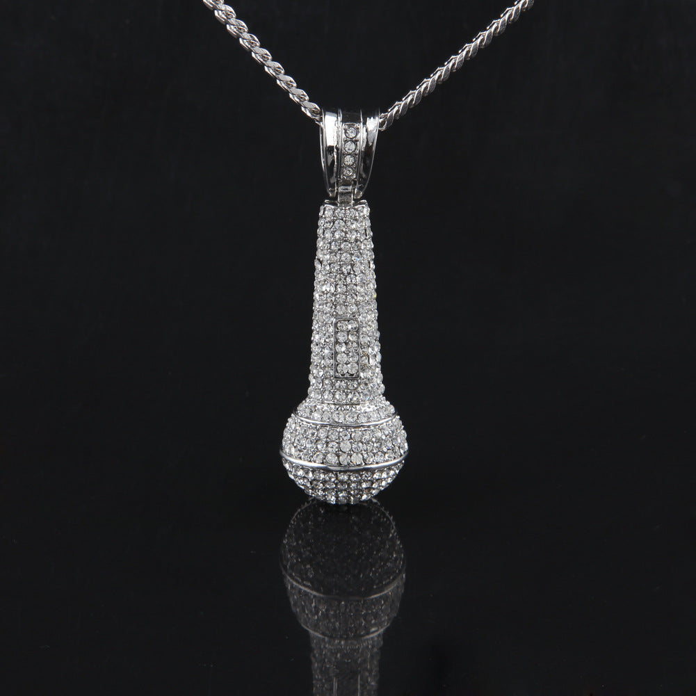 Hip-hop diamond-encrusted microphone necklaces. - MERGE.DAY.1.FREESTYLE