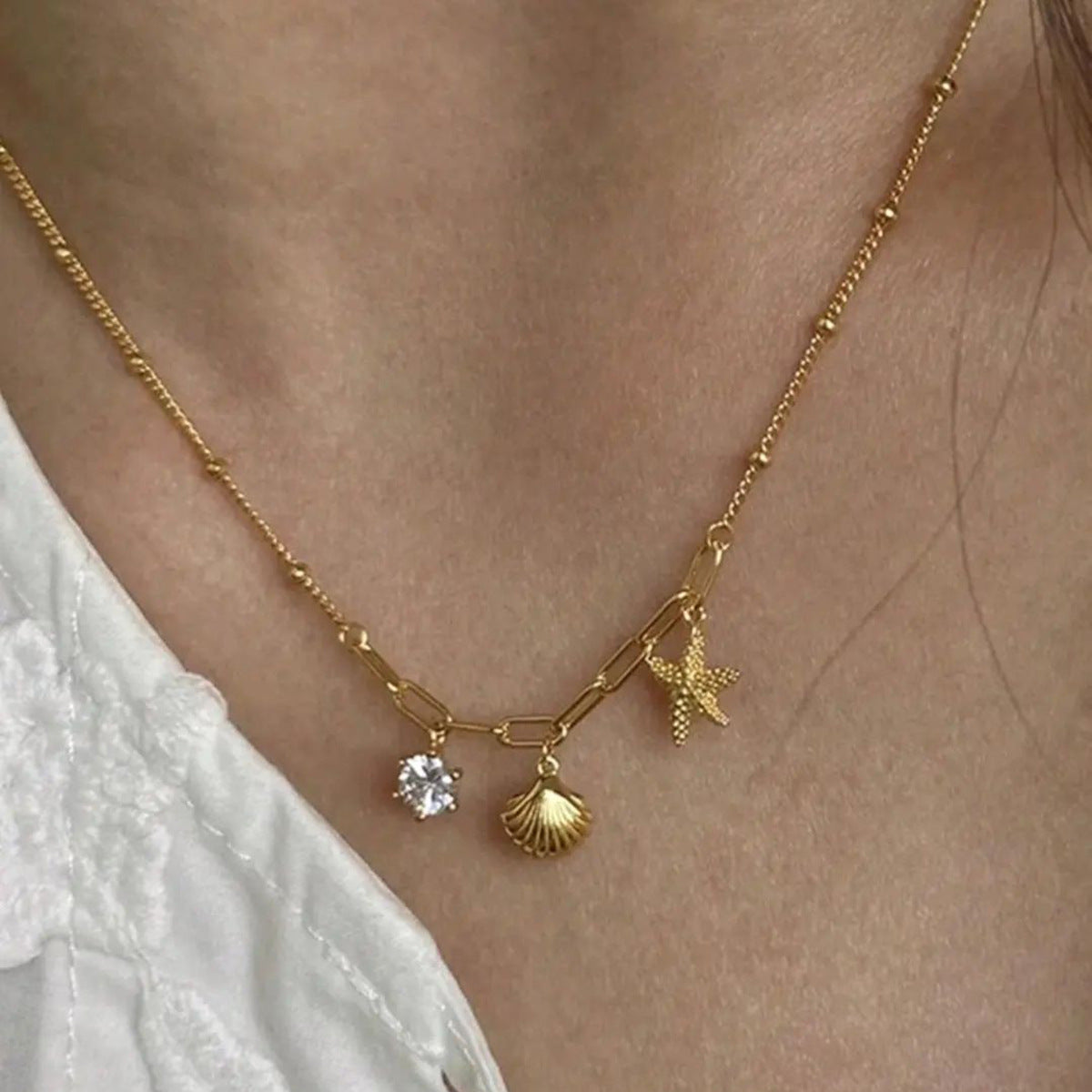 Small starfish shell zircon necklace - MERGE.DAY.1.FREESTYLE