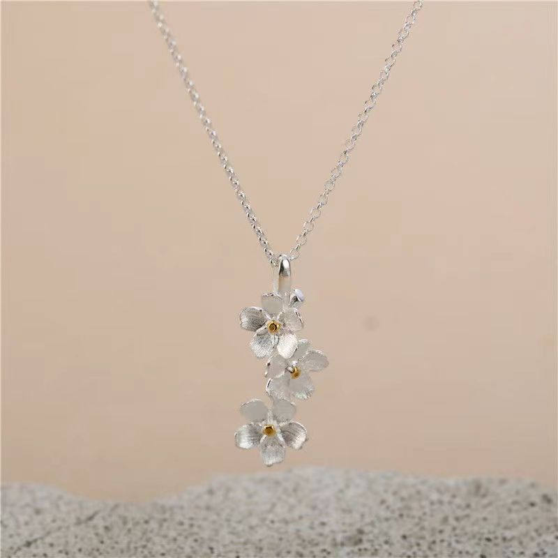 triangle forget me not necklace - MERGE.DAY.1.FREESTYLE